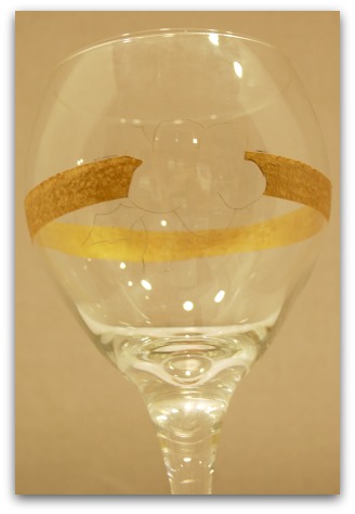 Remove the gold paint where it runs through the flower petals and leaves using a sharp blade.