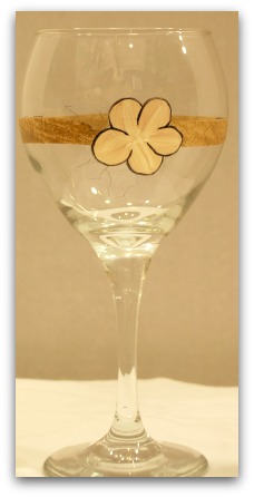 Outline each flower petal using the liner brush and black paint.