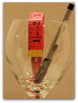 Measure and mark off 1-3/4 to 2 inches down from the rim of the glass.